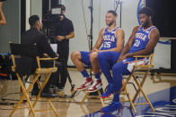 Philadelphia 76ers' Ben Simmons, left, and Joel Embiid, right, conduct interviews during media day at the NBA basketball team's practice facility, Monday, Sept. 30, 2019, in Camden. (AP Photo/Chris Szagola)