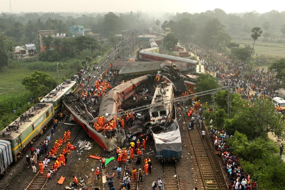 A drone shot of rescuers work at the site of passenger trains accident, in Balasore district (Copyright 2023 The Associated Press. All rights reserved.)