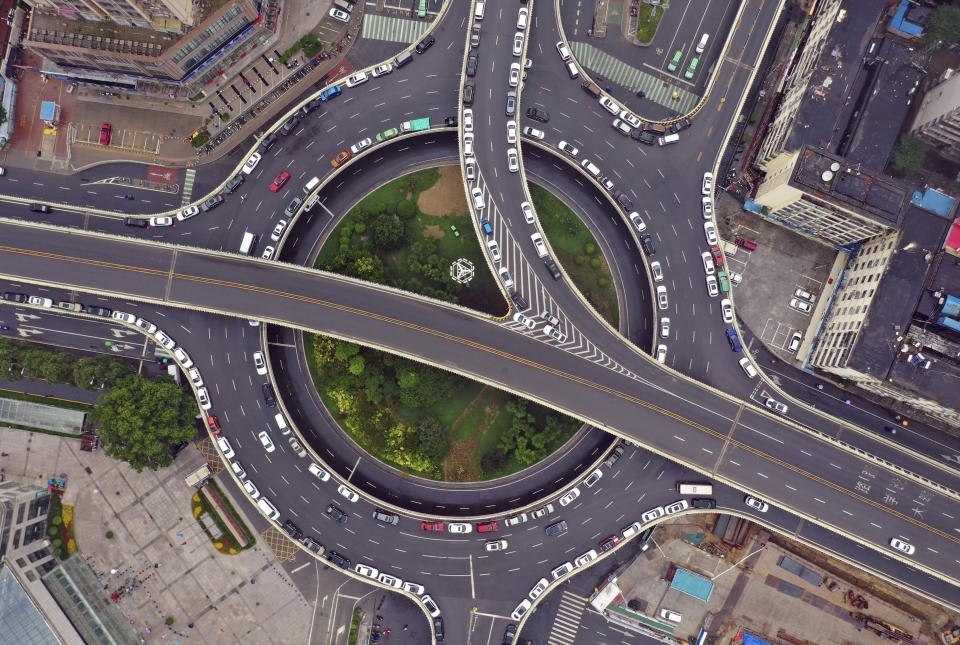 In this aerial photo released by Xinhua News Agency, cars are parked on elevated highways to avoid potential floods in Zhengzhou, in central China's Henan province on Sunday, Aug 22, 2021. Torrential rains in central China caused landslides, knocked out power and damaged houses, but no deaths were reported in a region where flooding killed more than 300 people last month, the government said Monday. (Li Jianan/Xinhua via AP)