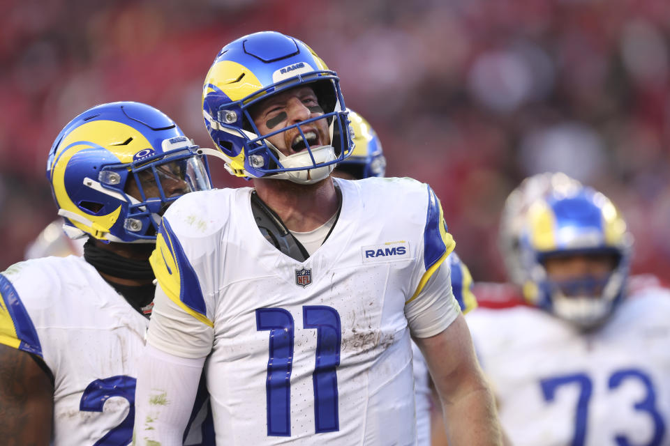 Los Angeles Rams quarterback Carson Wentz (11) celebrates after scoring against the San Francisco 49ers during the second half of an NFL football game in Santa Clara, Calif., Sunday, Jan. 7, 2024. (AP Photo/Jed Jacobsohn)