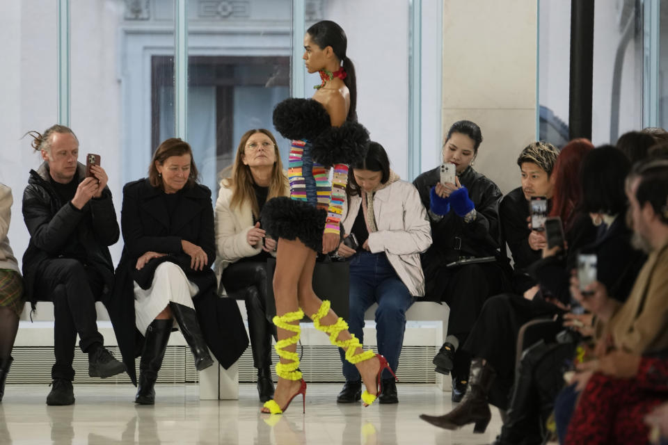 A model wears a creation as part of the Tomo Koizumi women's Fall-Winter 2023-24 collection presented in Milan, Italy, Sunday, Feb. 26, 2023. (AP Photo/Luca Bruno)