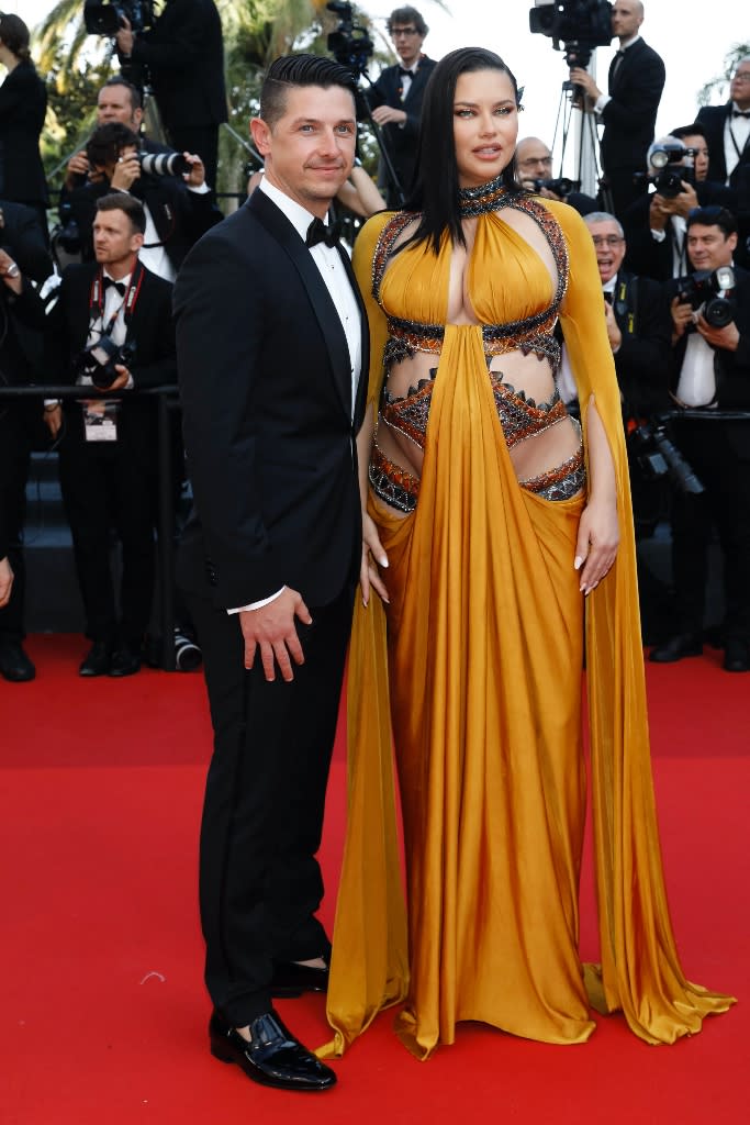 Adriana Lima and Andre Lemmers attend the world premiere of “Elvis” at the 2022 Cannes Film Festival on May 25, 2022. - Credit: MEGA