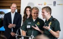 Britain's Kate and Prince William, The Duke and Duchess of Cambridge listen to ambulance team members Dan Farnworth and Rich Morton speak about how they helped each other cope with traumatic situations at a reception of the mental health charity "Heads together" on world mental health day in London, Britain October 10, 2016. REUTERS/Richard Pohle/Pool