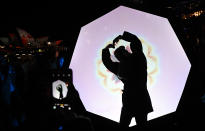 <p>Attendees gesture at an art installation during the official opening night of Vivid Sydney on May 27, 2016. (Sam Mooy/EPA </p>