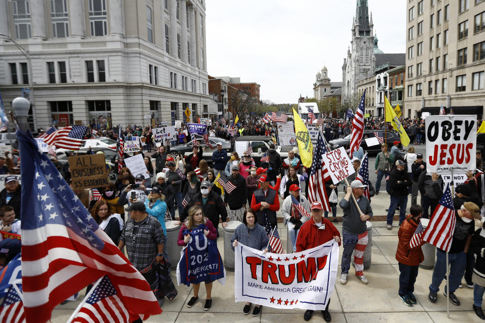 Protesters demonstrate at the state Capitol in Harrisburg, Pa., Monday, April 20, 2020, demanding that Gov. Tom Wolf reopen Pennsylvania's economy even as new social-distancing mandates took effect at stores and other commercial buildings. (AP Photo/Matt Slocum)
