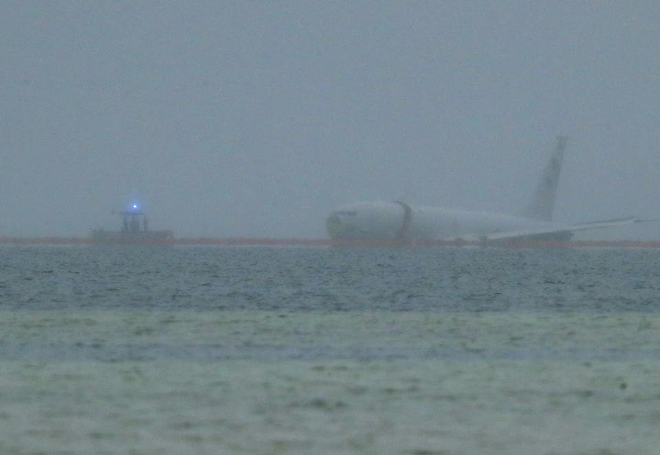 A downed U.S. Navy aircraft is seen in Kaneohe Bay, Monday, Nov. 20, 2023, in Kaneohe, Hawaii. (Jamm Aquino/Honolulu Star-Advertiser via AP)