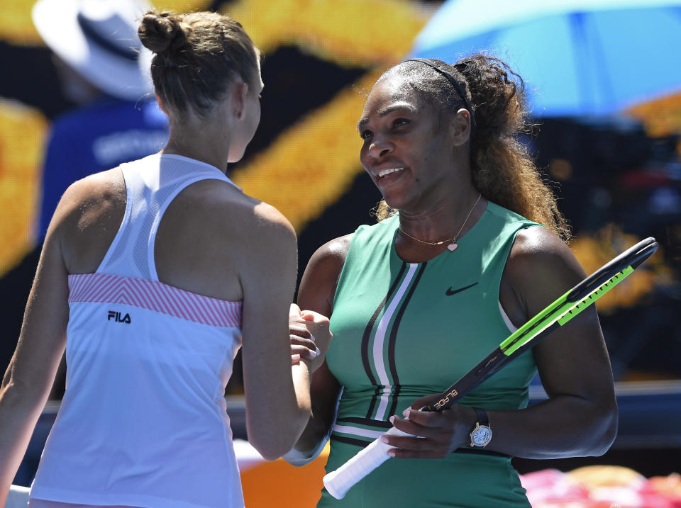 Karolina Pliskova of the Czech Republic, left, is congratulated by United States' Serena Williams after winning their quarterfinal match at the Australian Open tennis championships in Melbourne, Australia, Wednesday, Jan. 23, 2019. (AP Photo/Andy Brownbill)
