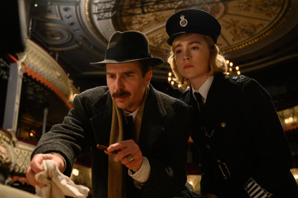 A detective (Sam Rockwell, left) and a rookie cop (Saoirse Ronan) investigate a murder in the mystery comedy "See How They Run."