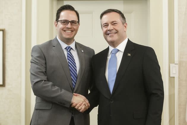 Alberta Premier Jason Kenney shakes hands with Demetrios Nicolaides, Minister of Advanced Education after being sworn into office, in Edmonton on Tuesday April 30, 2019.