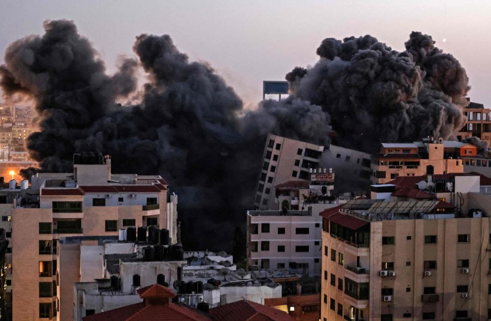 TOPSHOT - Smoke billows from an Israeli air strike on the Hanadi compound in Gaza City, controlled by the Palestinian Hamas movement, on May 11, 2021. (Photo by MAHMUD HAMS / AFP) (Photo by MAHMUD HAMS/AFP via Getty Images)