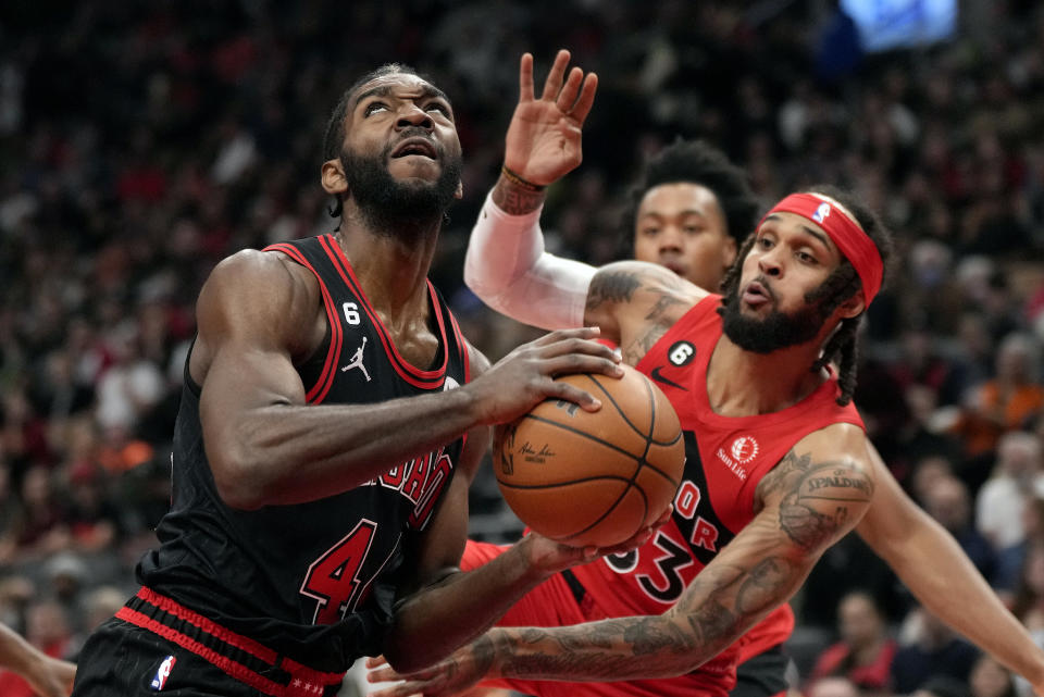 Toronto Raptors guard Gary Trent Jr. (33) defends as Chicago Bulls forward Patrick Williams (44) looks for a shot during first-half NBA basketball game action in Toronto, Sunday, Nov. 6, 2022. (Frank Gunn/The Canadian Press via AP)