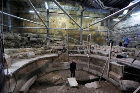 Israel Antiquities Authority archaeologist Dr. Joe Uziel stands inside a theatre-like structure during a media tour to reveal the structure which was discovered during excavation works underneath Wilson's Arch in the Western Wall tunnels in Jerusalem's Old City October 16, 2017. REUTERS/Ronen Zvulun