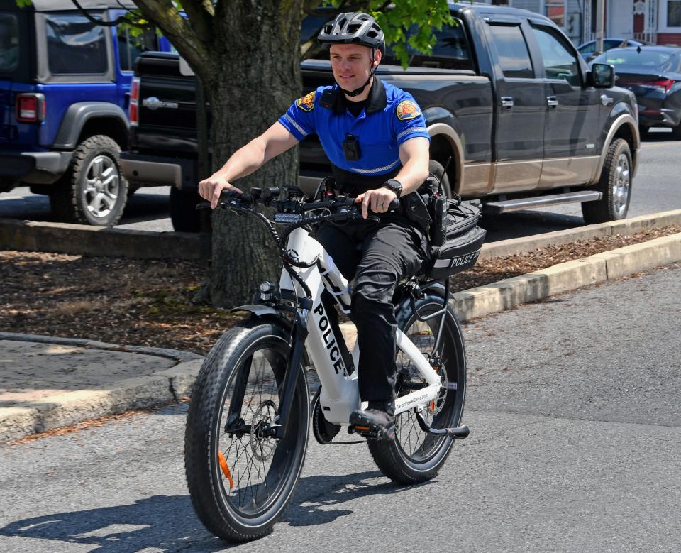 Lebanon City Police Department Bicycle Unit Officer Travis Pidcock rolls out on the unit's new Recon Interceptor electronic bike Monday morning. "We're able to respond to calls faster, and the biggest part of that is now we are not winded or exhausted," he said.