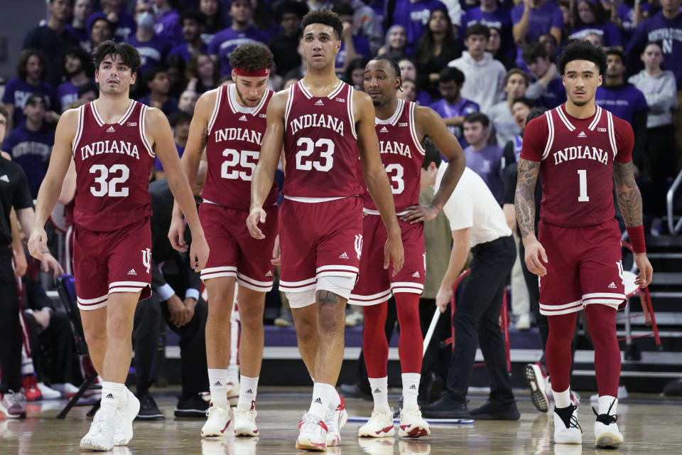 Indiana players, including Trey Galloway (32), Race Thompson (25), Trayce Jackson-Davis (23) and Jalen Hood-Schifino (1) walk on the court during the first half of an NCAA college basketball game against Northwestern in Evanston, Ill., Wednesday, Feb. 15, 2023. (AP Photo/Nam Y. Huh)