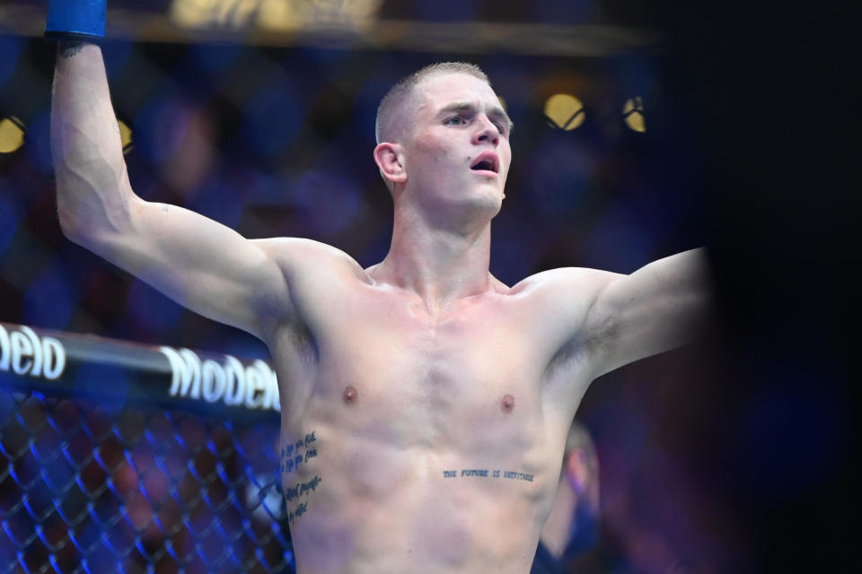 Aug 19, 2023; Boston, MA, USA; Ian Garry (blue gloves) reacts to defeating Nail Magny (red gloves) during UFC 292 at TD Garden. Mandatory Credit: Bob DeChiara-USA TODAY Sports