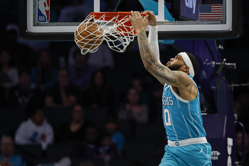 Charlotte Hornets forward Miles Bridges dunks against the Utah Jazz during the first half of an NBA basketball game in Charlotte, N.C., Saturday, Jan. 27, 2024. (AP Photo/Nell Redmond)
