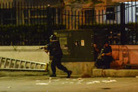 <p>Filipino elite Police Special Weapons and Tactical (SWAT) personnel maneuver outside the Resort World Manila hotel in Pasay city, south of Manila, Philippines, June 2, 2017. (Photo: Ezra Acayan/EPA) </p>