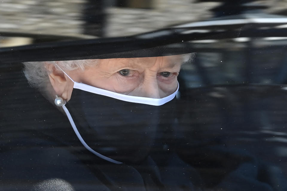 Britain's Queen Elizabeth II arrives in the Royal Bentley at the funeral for her husband, Britain's Prince Philip, Duke of Edinburgh to St George's Chapel in Windsor Castle in Windsor, west of London, on April 17, 2021. - Philip, who was married to Queen Elizabeth II for 73 years, died on April 9 aged 99 just weeks after a month-long stay in hospital for treatment to a heart condition and an infection. (Photo by LEON NEAL / POOL / AFP) (Photo by LEON NEAL/POOL/AFP via Getty Images)