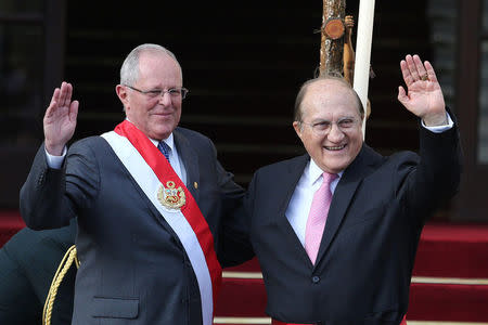 Peru's President Pedro Pablo Kuczynski and new Minister of Health Fernando D'Alessio pose for a picture during his swearing-in ceremony at the government palace in Lima, Peru September 17, 2017. REUTERS/Guadalupe Pardo