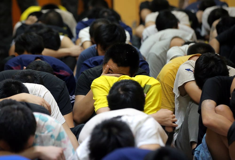 File picture of undocumented migrants who were arrested in an immigration bust are seen at the Sessions Court in Teluk Intan January 2, 2020. — Picture by Farhan Najib