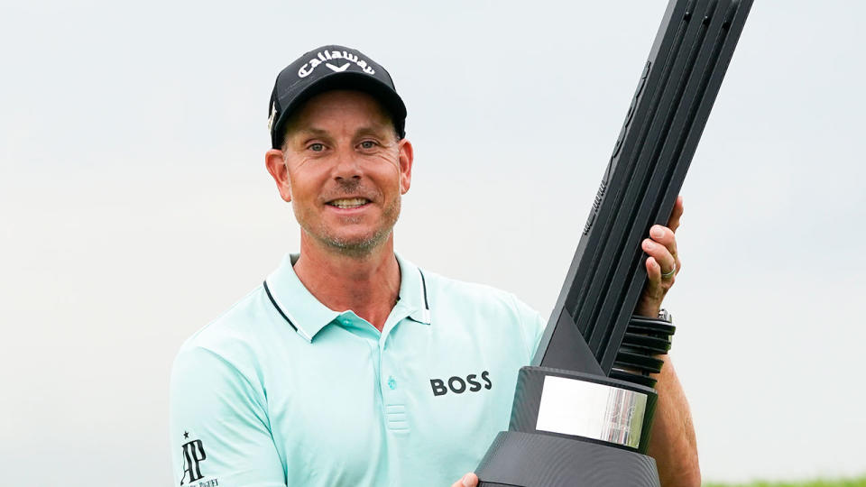 Pictured here, Henrik Stenson holds the trophy aloft after victory in his very first LIV Golf event at Bedminster.