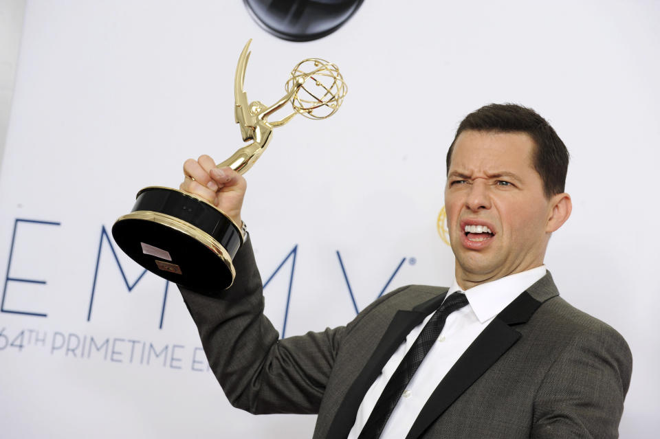 Actor Jon Cryer, winner of Outstanding Lead Actor in a Comedy Series, poses backstage at the 64th Primetime Emmy Awards at the Nokia Theatre on Sunday, Sept. 23, 2012, in Los Angeles. (Photo by Jordan Strauss/Invision/AP)