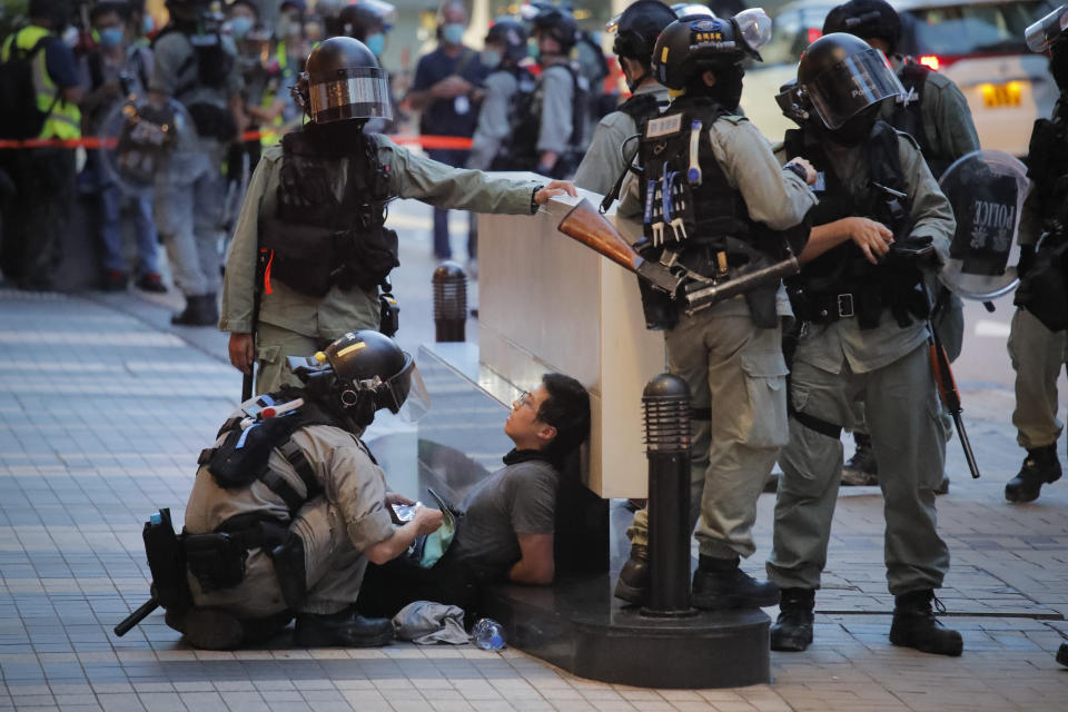 Police detained a protester during a march marking the anniversary of the Hong Kong handover from Britain to China, Wednesday, July. 1, 2020, in Hong Kong. Hong Kong marked the 23rd anniversary of its handover to China in 1997 just one day after China enacted a national security law that cracks down on protests in the territory. (AP Photo/Kin Cheung)