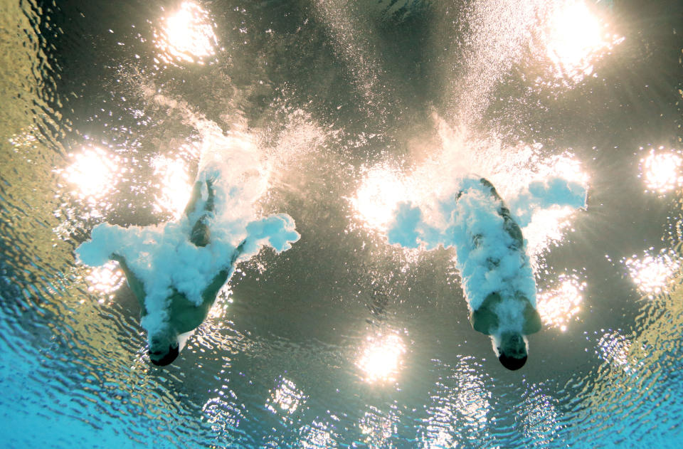 LONDON, ENGLAND - JULY 30: (L-R) Ivan Garcia Navarro and German Sanchez Sanchez of Mexico look on from the pool deck during the Men's Synchronised 10m Platform Diving on Day 3 of the London 2012 Olympic Games at the Aquatics Centre on July 30, 2012 in London, England. (Photo by Adam Pretty/Getty Images)