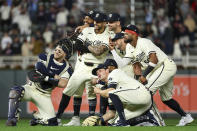 Members of the Minnesota Twins celebrate after their win over the Boston Red Sox in a baseball game, Friday, May 3, 2024, in Minneapolis. (AP Photo/Matt Krohn)