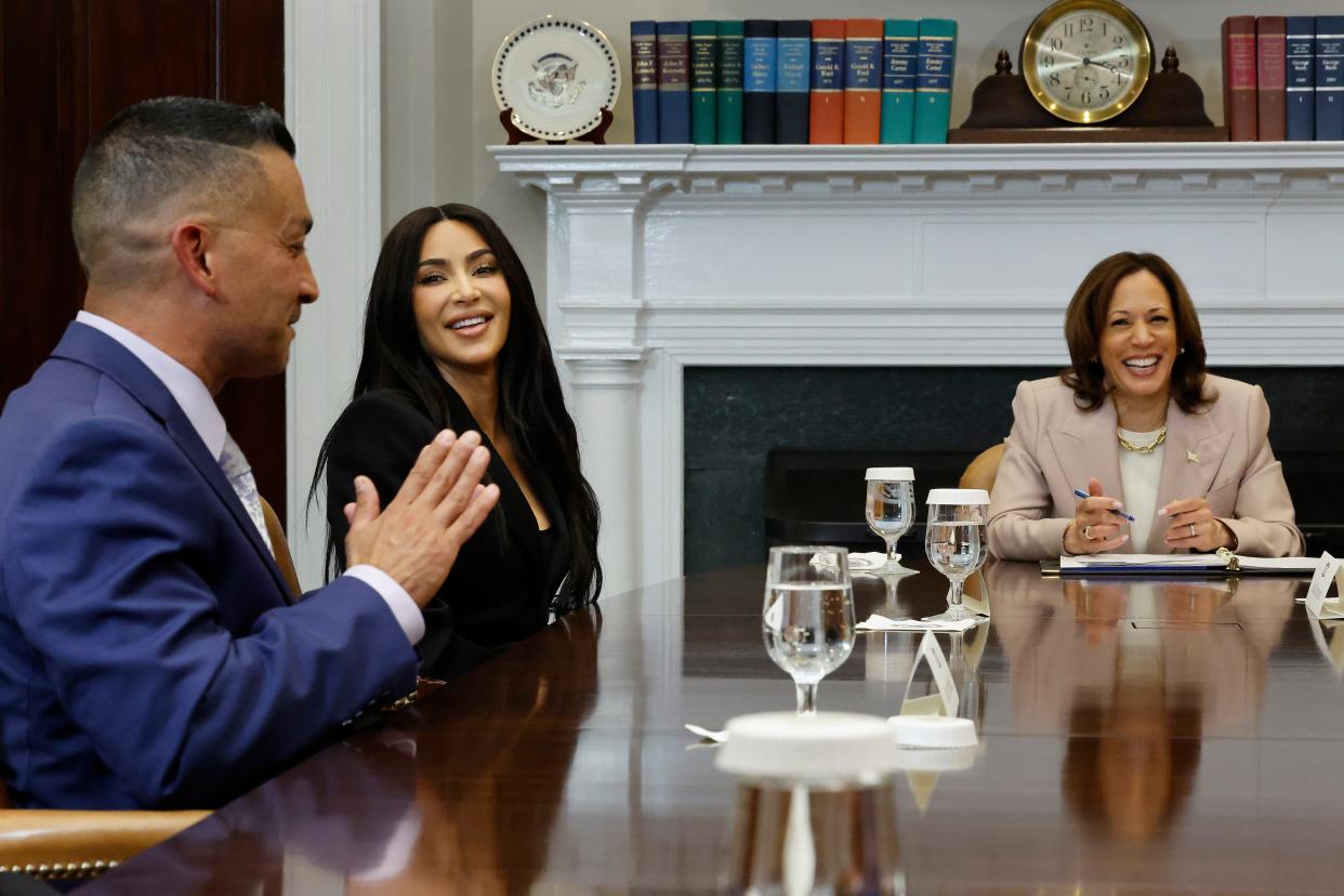 Kim Kardashian, center, joins Vice President Kamala Harris as they listen to Jason Hernandez during a roundtable discussion on criminal justice reform in the Roosevelt Room at the White House on April 25, 2024, in Washington, D.C.