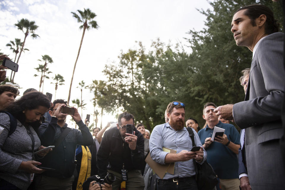 Scott Warren talks to supporters outside the Federal Courthouse after his trial, Wednesday, Nov. 20, 2019 in Tucson, Ariz. Warren was acquitted Wednesday on charges he illegally harbored two Central American immigrants at a camp in southern Arizona operated by a humanitarian group. (Josh Galemore/Arizona Daily Star via AP)