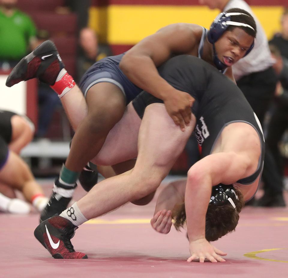 Thomas Stewart of Blair Academy takes down Perry's Logan Shephard during a 5-2 win in the Final Round of the Ironman Wrestling Tournament on Saturday, Dec. 11, 2021 in Cuyahoga Falls, at Walsh Jesuit High School.