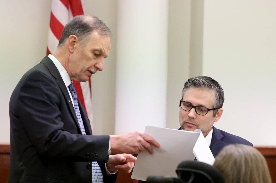 Defense attorney Bob Gill, left, questions psychologist Dr. Kyle Clayton during the sentencing phase of Aaron Dean’s trial in Tarrant County’s 396th District Court on Friday in Fort Worth. Dean, a former Fort Worth police officer, was found guilty of manslaughter in the 2019 shooting death of Atatiana Jefferson.