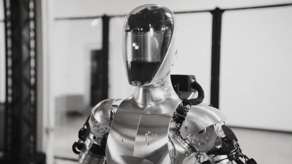 The top half of a black and steel humanoid robot made by Figure