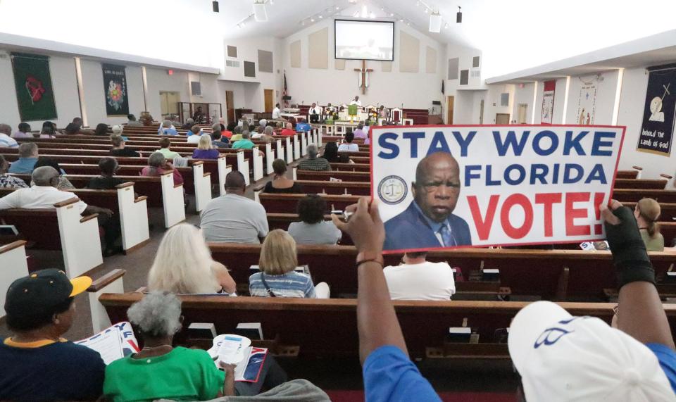 People gather at Allen Chapel AME Church, Friday June 23, 2023 as the Stay Woke Rolling Votercade buses make a stop in Daytona Beach.