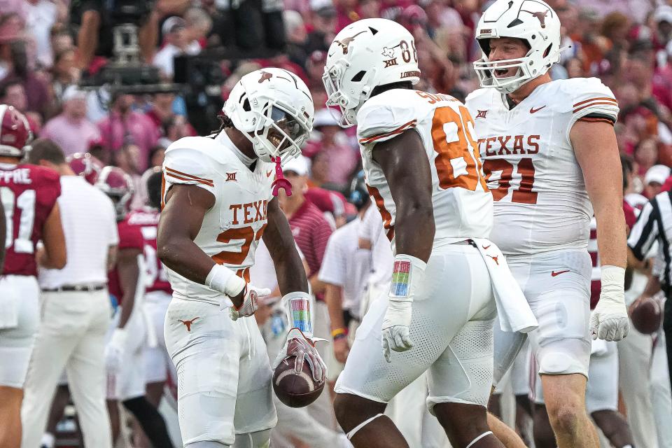 Texas defensive back Jahdae Barron celebrates his first-quarter interception in Saturday's 34-24 win over Alabama. The Longhorns picked off two Jalen Milroe passes and sacked the Alabama quarterback five times.