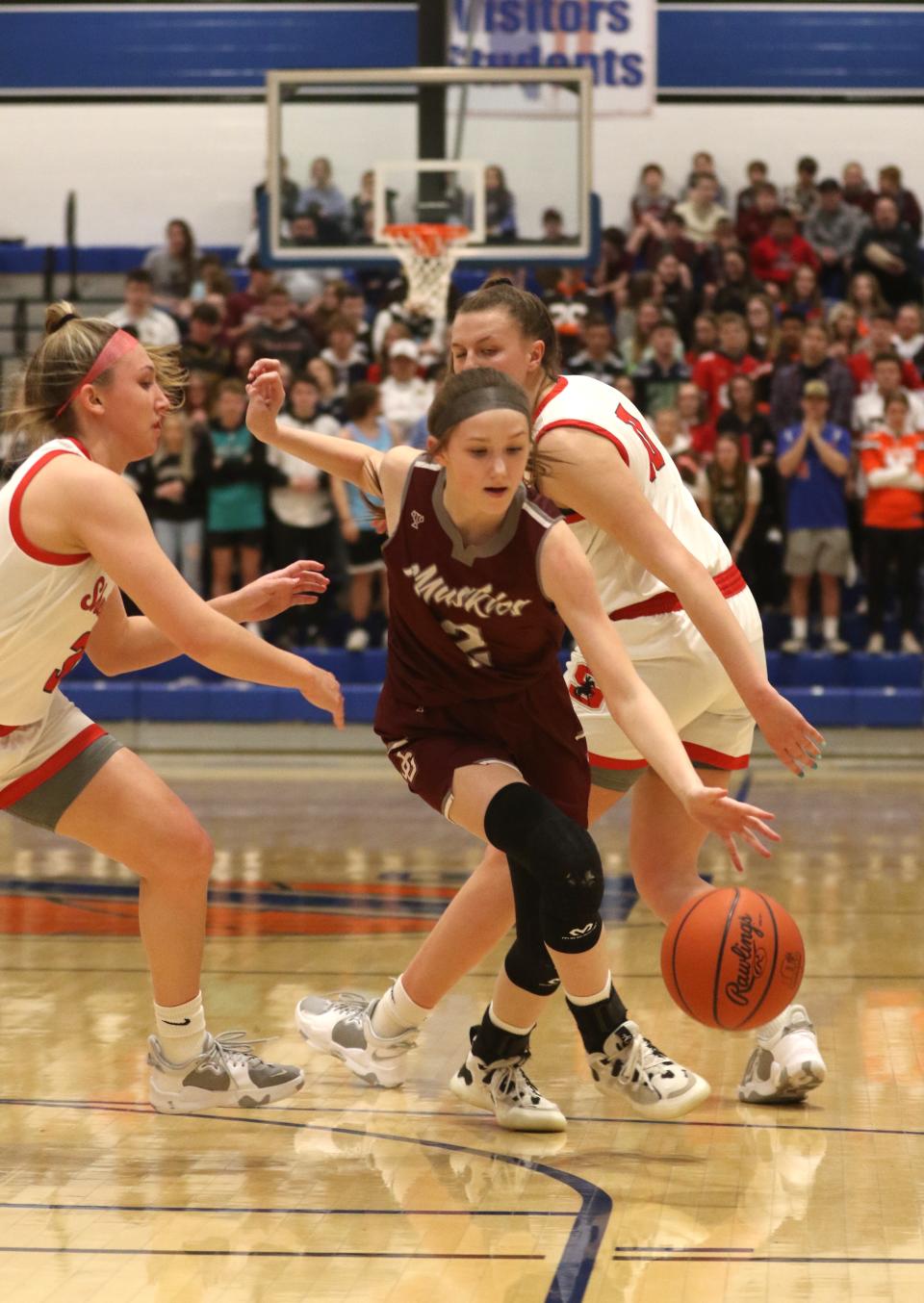 John Glenn's Mya Oliver finds her way between a pair of Sheridan defenders. Oliver is one of several promising players for the Muskies, who plan on building off last year's regional tournament run.