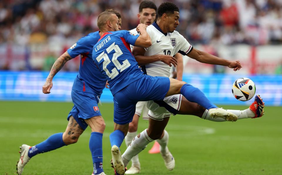 Jude Bellingham battles for possession during England's Euro 2024 last-16 tie against Slovakia
