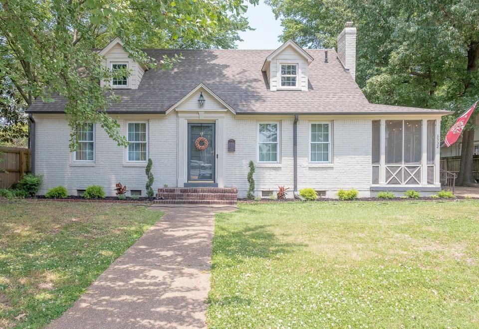 The house features gleaming hardwood floors, a beautiful fireplace, stunning white granite countertops and stainless steel appliances.