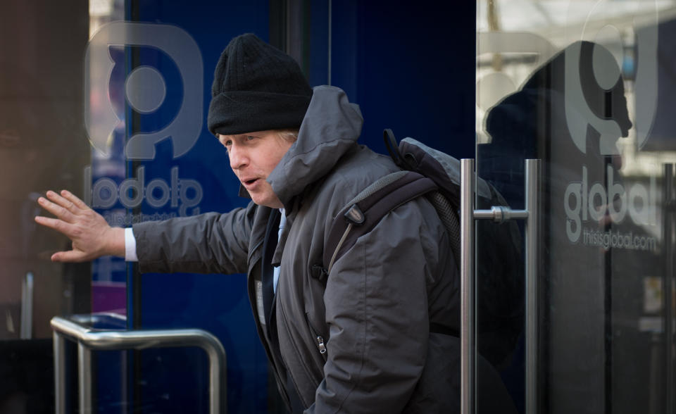 Mayor of London Boris Johnson leaves Global Radio studios in central London after presenting his regularly phone-in show for LBC radio following David Cameron comments that he is ruling out a third term as Prime Minister.