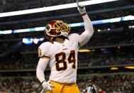 ARLINGTON, TX - NOVEMBER 22: Niles Paul #84 of the Washington Redskins celebrates in the end zone after scoring against the Dallas Cowboys on Thanksgiving Day at Cowboys Stadium on November 22, 2012 in Arlington, Texas. The Washington Redskins beat the Dallas Cowboys 38-31. (Photo by Tom Pennington/Getty Images)