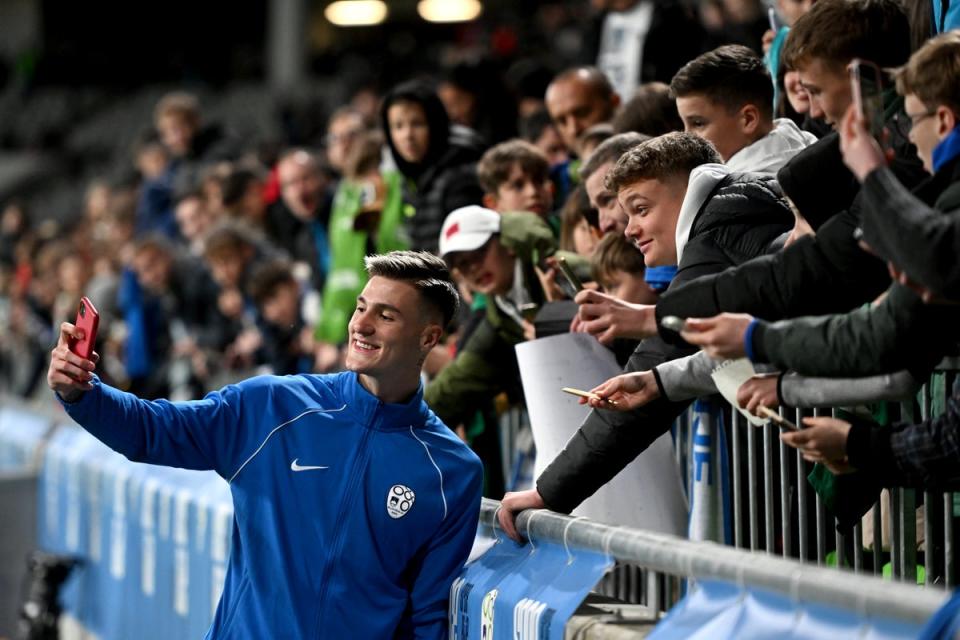 Benjamin Sesko takes selfies with Slovenia fans (Getty Images)