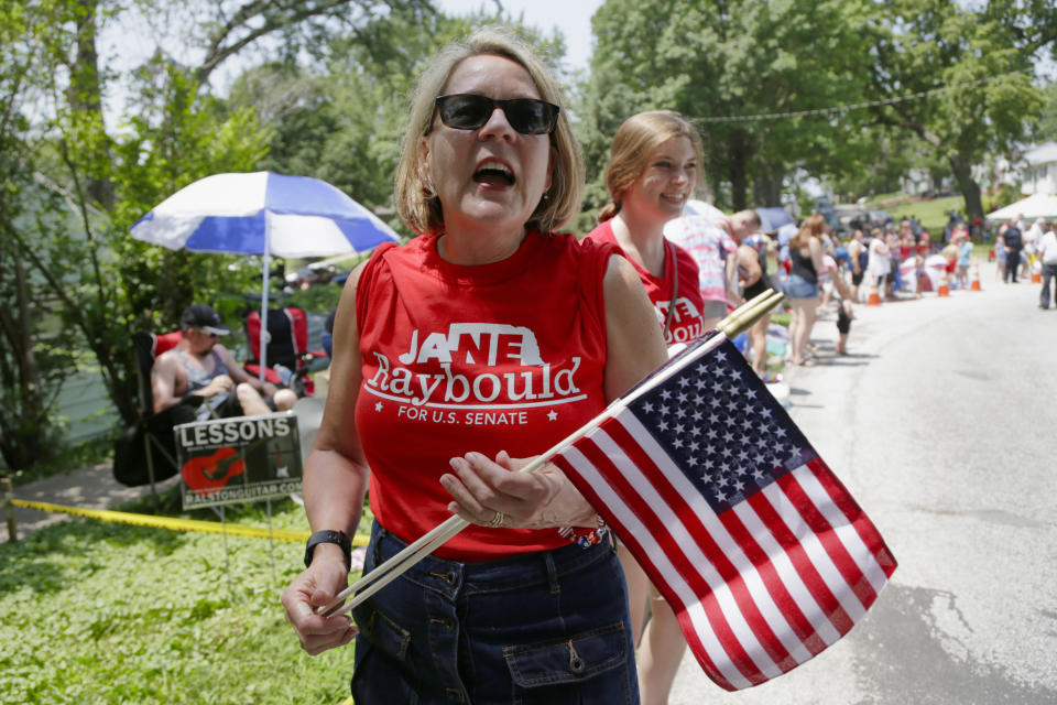 In this July 4, 2018, photo, Democratic candidate for Senate Jane Raybould campaigns during a Fourth of July parade in Ralston, Neb. Democrats thought they might have a winning candidate in Raybould, a moderate Lincoln businesswoman and city councilwoman who challenged U.S. Sen. Deb Fischer, R-Neb., in 2018. Raybould launched her campaign in the heat of President Donald Trump's trade war with China, outlining a pro-trade agenda as farmers throughout the state struggled financially. It made little difference to voters, however, and Fischer coasted to re-election with nearly 58% of the vote in a year when Democratic wins nationally helped the party regain control of the House. (AP Photo/Nati Harnik)