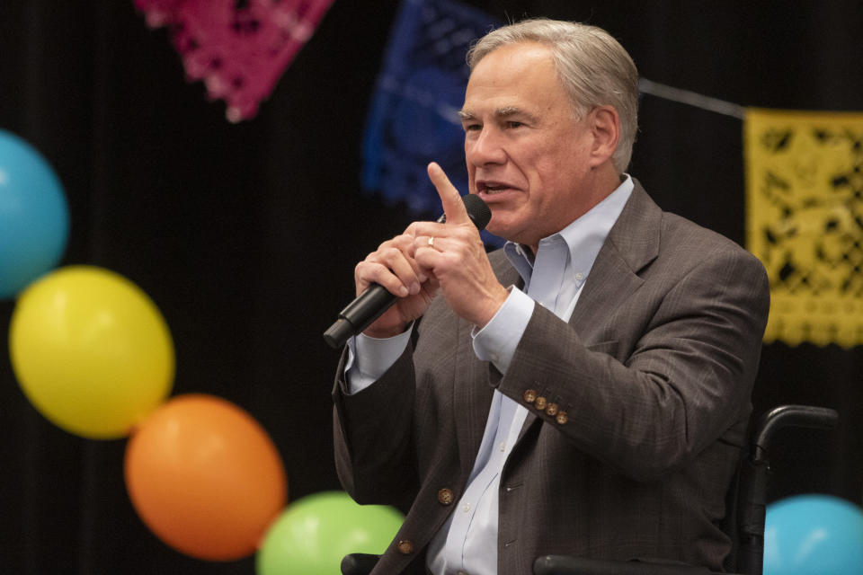 Gov. Greg Abbott speaks on a variety of matters including a border wall, razor wire, critical race theory, Election laws, mail in ballots, voter fraud, and more at the Midland Chapter of the Republican National Hispanic Assembly's Reagan Lunch at the Bush Convention Center Friday, Nov. 5, 2021, in Midland, Texas. (Jacob Ford/Odessa American via AP)