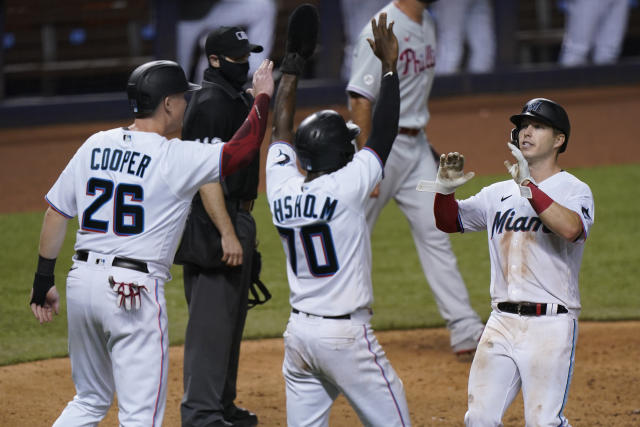 Miami Marlins' Jazz Chisholm Jr. (2) celebrates with Starling Marte (6) and  Jesus Aguilar (24) after Chisholm hit a home run during the third inning of  the team's baseball game against the