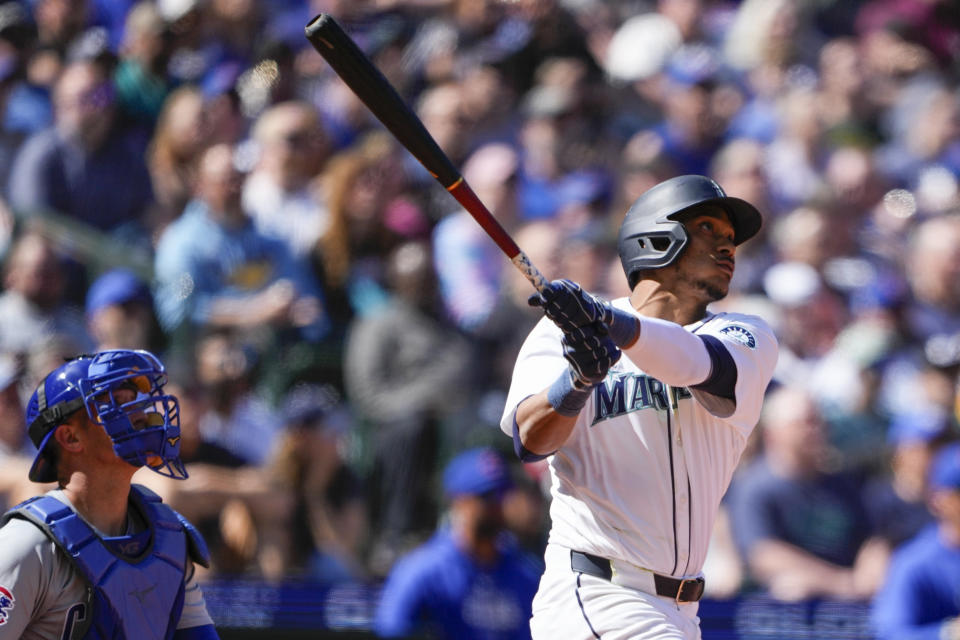 Seattle Mariners' Jorge Polanco follows through on a two-run home run against the Chicago Cubs during the sixth inning of a baseball game Sunday, April 14, 2024, in Seattle. (AP Photo/Lindsey Wasson)