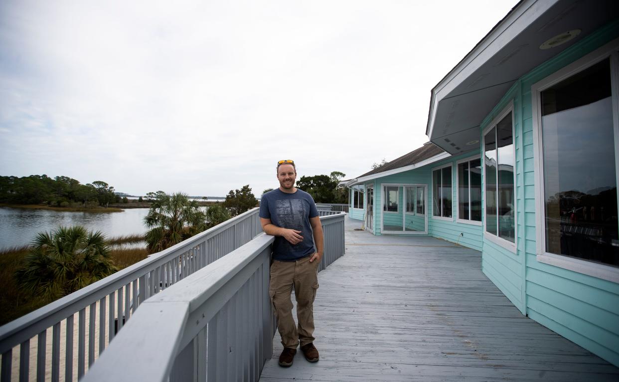 Owner Tyler Rice stands outside Trident on Tuesday, Dec. 13, 2022. The restaurant will opened in 2023 in Panacea, Fla.