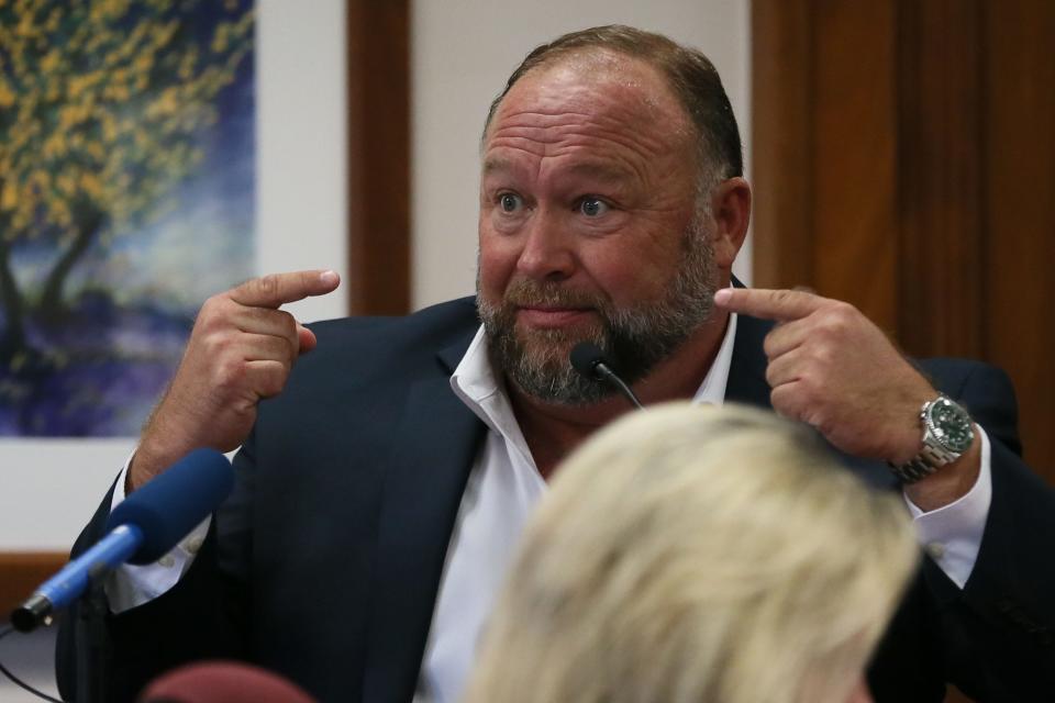 Alex Jones testifies Aug. 2 in his trial in Austin. The judge in the case plans to order the InfoWars founder to pay the full $49.3 million an Austin jury awarded the parents of a 6-year-old Sandy Hook Elementary School shooting victim.