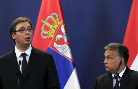 Hungarian Prime Minister Viktor Orban (R) and Serbian Prime Minister Aleksandar Vucic hold a joint news conference in Budapest, Hungary, July 1, 2015. REUTERS/Bernadett Szabo