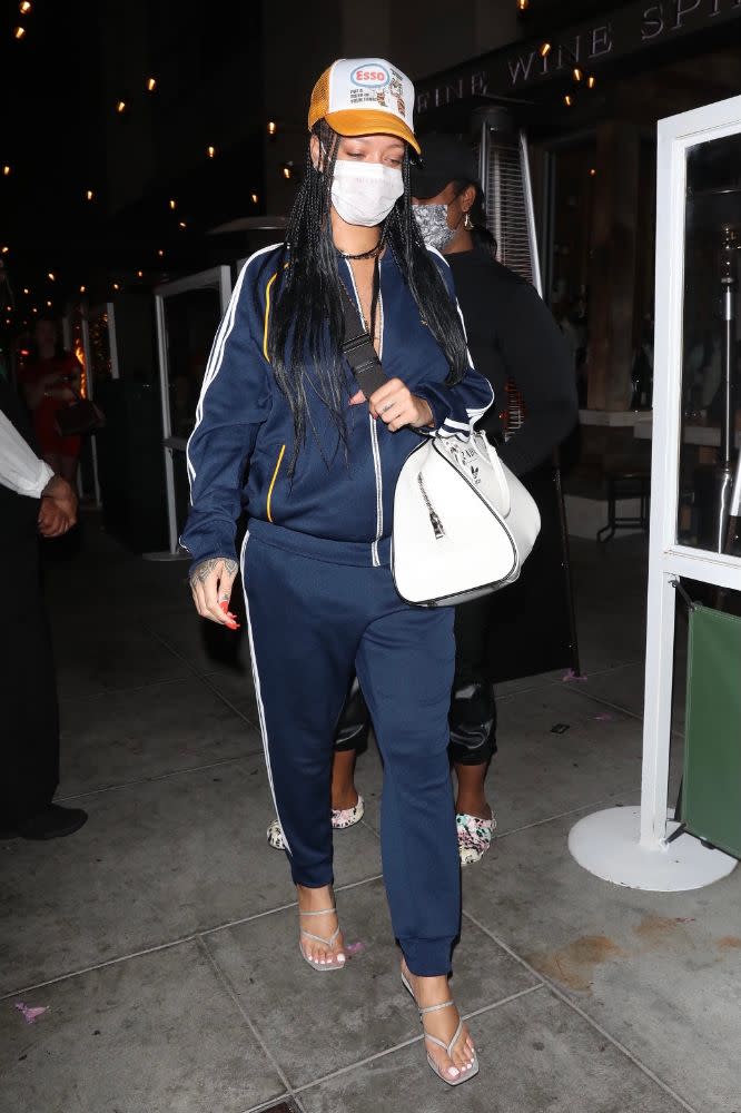 Rihanna steps out in a retro-chic tracksuit for dinner in Los Angeles, April 12. - Credit: 007/photographer group/MEGA